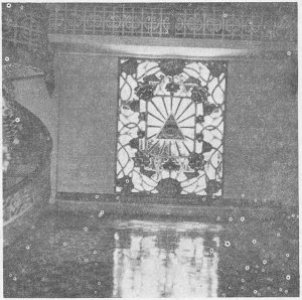 The eye within a triangle is a symbol of   the CAO DAI faith. This window is at the Tay Minh Temple