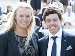 Close shave: Golfer Rory McIlroy - pictured with his girlfriend, tennis star Caroline Wozniacki, in April - almost failed to arrive in time for his match