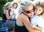 Just me and my little man! Kendra Wilkinson shares a kiss and a cuddle with her son Hank Jr as pair enjoy a play date in the park 