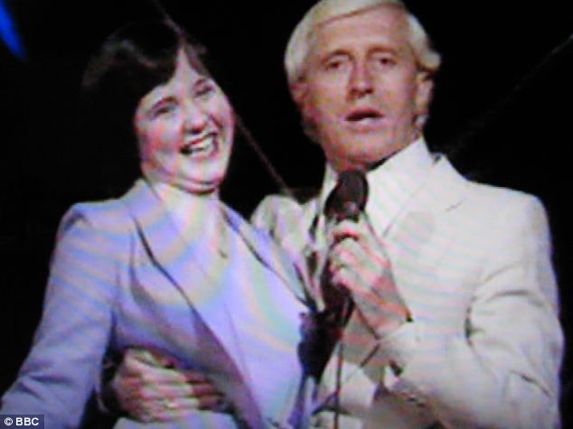 'He was all over me': 14-year-old Coleen Nolan (pictured with Savile on Top Of The Pops in 1979) said she was horrified when he intimately cuddled her on the show