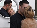 Definitely more than friends: Sheridan Smith and Winehouse's ex Reg Traviss pictured sharing a kiss outside his flat