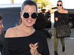 Travelling in style: Khloe Kardashian jets off to Miami toting a giant designer handbag