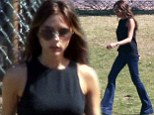 It's all in the jeans! Victoria Beckham looks slim and leggy in flared denim as she cheers on son Cruz in soccer match 