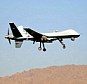 A step too far? The Home Office has given police permission to use military-style drones like the one above which traditionally carry missiles as a crime-fighting tool over the skies of Britain