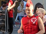 Mark Salling dresses as a superhero on the set of Glee