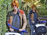 The Queen of shops and her new heir: Mary Portas takes new-born baby for stroll but looks far from her polished self