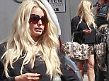 Back in front of the camera: Jessica Simpson shows off her legs as she continues to shed her baby weight