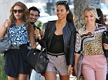 My legs are better than yours! The Saturdays show off their pins as they spend another day in an LA recording studio