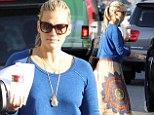 No time for the polished look anymore! Molly Sims shows off new signature boho style in loose fitting outfit 